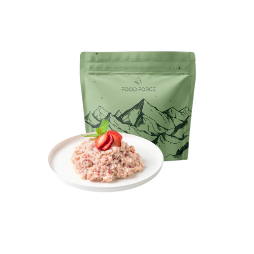 Green 'Food Force Rice Porridge with Strawberries' package with a plate of food on a white background