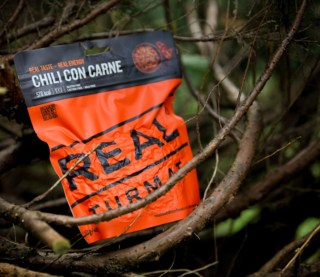 Orange package of Real Turmat Chili con Carne among branches