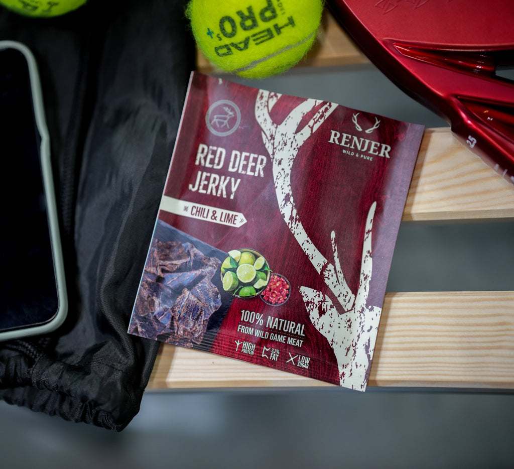Renjier Red Deer Jerky package with a tennis ball and red object in the background